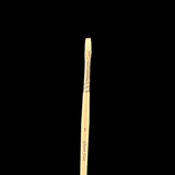Paintbrush with a wooden handle and metal ferrule on a black background