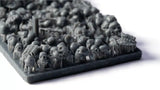 Collection of small gray figurines on a white background