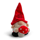 Plush gnome with red hat and mushroom, sitting on a white background