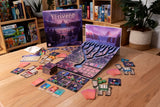 Board game set up on a wooden table with '12 Rivers' box in the background
