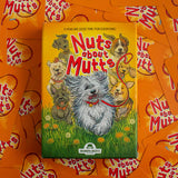 Board game box titled 'Nuts about Mutts' with illustrations of dogs on an orange background.