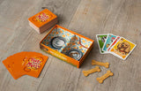 Dog-themed card game with cards and bone-shaped treats on a wooden surface