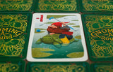 Card game with a card featuring a gnome riding a turtle, surrounded by green cards with text.