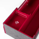 A close-up of a gray jewelry box with a bright red velvet interior, showing a small silver ring with a ring-like emblem on the bottom compartment. The brand name 'CAMEO JEWELRY' is partially visible on the exterior of the box.