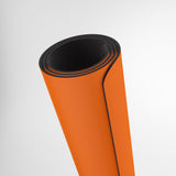 Orange roll of material with black edge on a white background