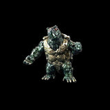 Metallic creature figurine on a black background
