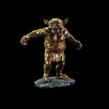 Bronze statue of a creature on a black background
