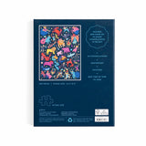 Jigsaw puzzle box with colorful constellation design on a blue background