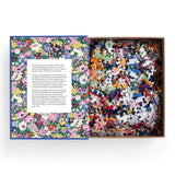 Jigsaw puzzle with colorful pieces and a floral-themed box on a white background