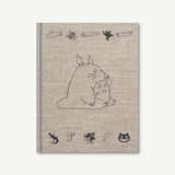 Notebook with a cartoon character on a beige background