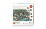 Puzzle box with illustrations of a cityscape and folded-out pieces on a white background