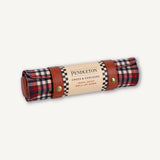 Roll-up chess and checkers game set in Pendleton plaid design on a white background
