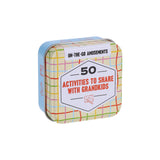 Tin box with colorful plaid design and text about activities for grandkids on a white background