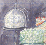 Partial puzzle of a dessert scene with a meringue cake and other treats.