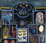 Jigsaw puzzle with decorative tiles featuring animals, birds, and nature-themed designs.