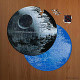 Death Star puzzle on a wooden surface with a completed section and pieces missing.