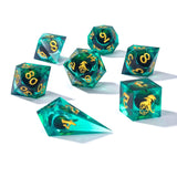 Set of teal polyhedral dice with gold numbers on a white background