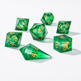 Set of green polyhedral dice with gold numbering on a white background