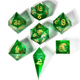 Set of green polyhedral dice with gold numbers and symbols on a white background