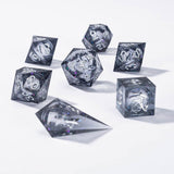 Set of clear polyhedral dice with black numbers on a white background