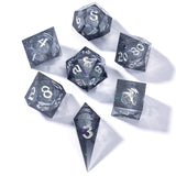 Set of polyhedral dice with metallic sheen on a white background