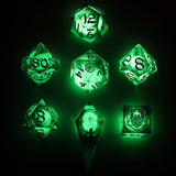 Set of green glowing polyhedral dice on a black background