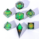 Set of green polyhedral dice with gold numbers on a white background