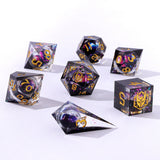 Set of polyhedral dice with gold and black numbering on a white background