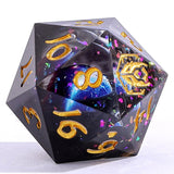 D20 polyhedral dice with gold numbers on a reflective surface