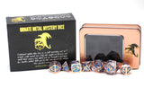 Ornate metal mystery dice set with packaging on a white background