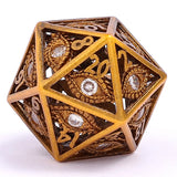 Decorative gold polyhedral dice with intricate designs on a white background