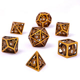 Set of intricately designed gold dice on a white background