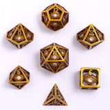Set of gold and bronze polyhedral dice on a white background