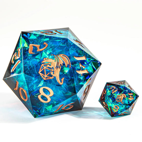 Two polyhedral dice with dragon design and blue and green color on a white background
