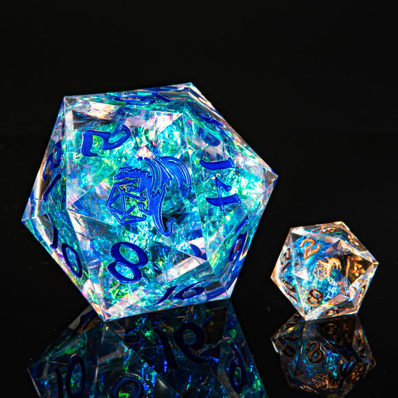Two crystal dice with blue dragon design on a black background
