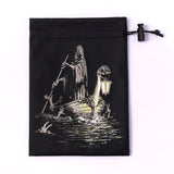 Black drawstring pouch with a ghost and ghostly figure on a boat design.