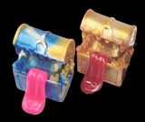 Two transparent plastic treasure chests with pink handles on a black background