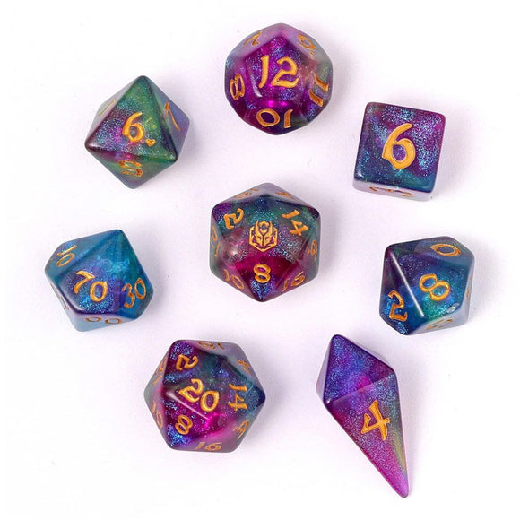 Set of colorful polyhedral dice with numbers on a white background