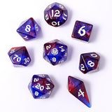 Set of purple and red polyhedral dice on a white background