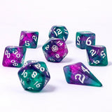 Set of purple and teal polyhedral dice on a white background