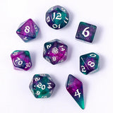 Set of purple and teal polyhedral dice on a white background