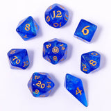 Blue dice set with gold numbers on a white background
