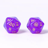 Two purple polyhedral dice with yellow numbers on a white background