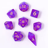 Purple dice set with gold numbers on a white background
