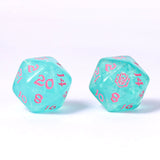 Two turquoise dice with pink numbers on a white background