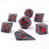 Set of gray dice with red numbers on a white background