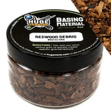 Jar of redwood debris with black lid labeled 'Huge Miniatures Basing Material'.