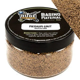Jar of 'Huge Miniatures' basing material with a black lid on a white background