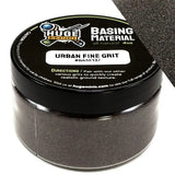 Huge Minis Basing Material jar with black lid and gray contents on a white background