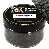 Huge Minis Basing Material jar with black lid and gray contents on a white background